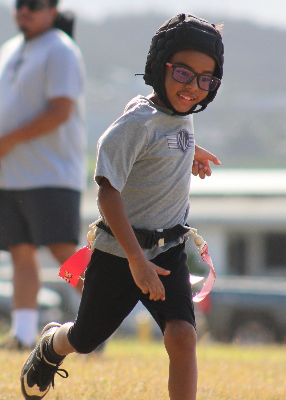 Pearl City Junior Chargers flag football player running