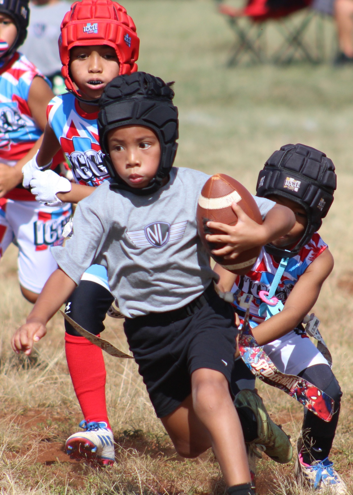 Pearl City Junior Chargers ball carrier advancing downfield