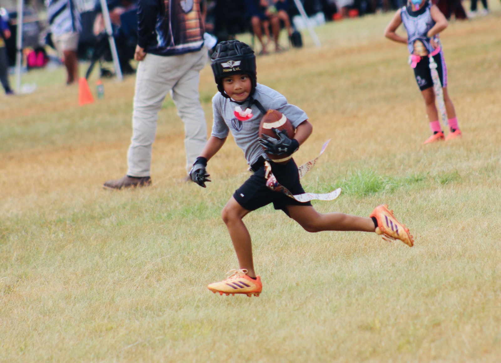 Pearl City Junior Chargers runner crossing the field